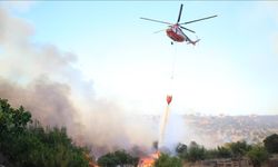 Çanakkale'de çöplük alandan ormana sıçrayan yangının ilerlemesi durduruldu