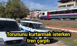 Torununu kurtarmak isterken tren çarptı
