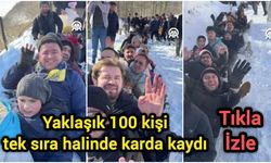 Yaklaşık 100 kişi tek sıra halinde karda kaydı